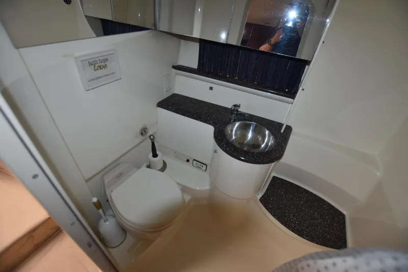 Slide: The Image of 2004 Formula 400 Super Sport bathroom with sink and toilet. - 21