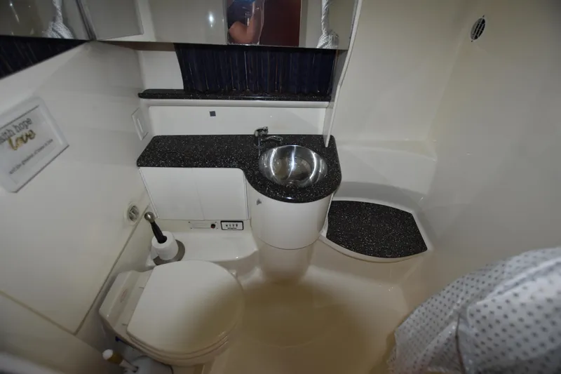 Slide: The Image of 2004 Formula 400 Super Sport yacht bathroom with modern sink and toilet. - 22