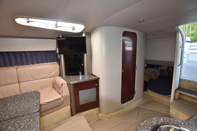 Slide: The Image of Interior of 2004 Formula 400 Super Sport yacht with seating, TV, and cabin area. - 24