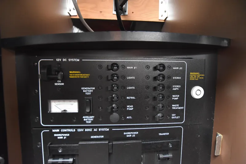 Slide: The Image of Control panel of a 2004 Formula 400 Super Sport boat, featuring various switches and indicators. - 28