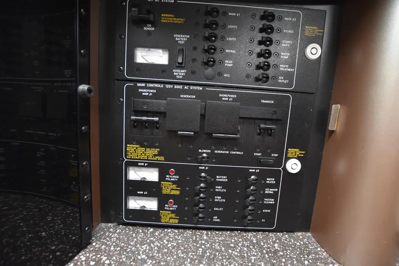 Slide: The Image of Control panel of a 2004 Formula 400 Super Sport boat, featuring switches and indicators. - 29