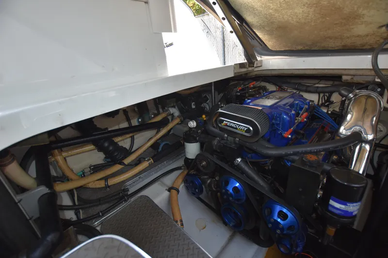 Slide: The Image of 2004 Formula 400 Super Sport engine compartment with Mercury engine components. - 35