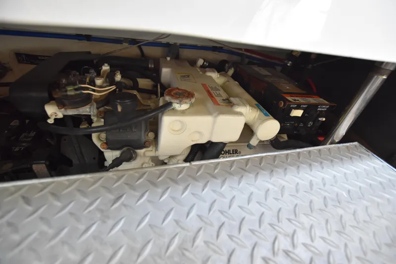 Slide: The Image of Engine compartment of 2004 Formula 400 Super Sport with Kohler generator and battery. - 37
