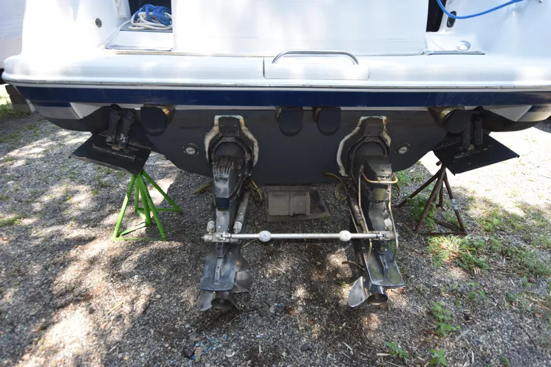 Slide: The Image of 2004 Formula 400 Super Sport boat stern with dual outboard motors on stands. - 5