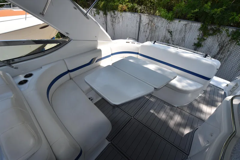 Slide: The Image of 2004 Formula 400 Super Sport boat interior with white seating and table. - 7