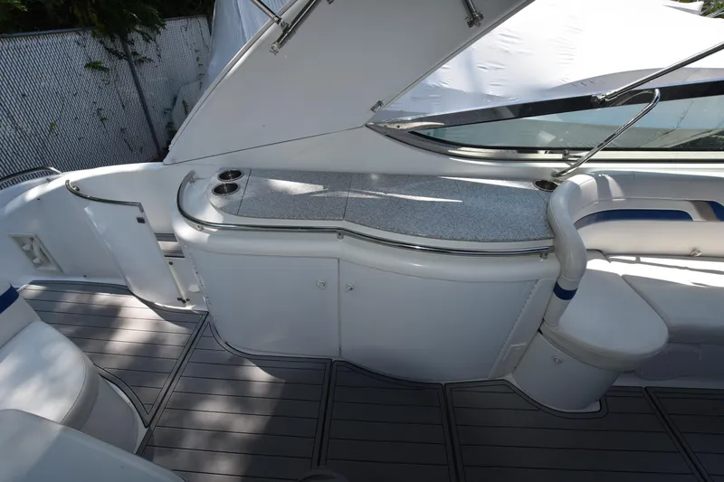 Slide: The Image of 2004 Formula 400 Super Sport boat interior with sleek seating and counter space. - 8
