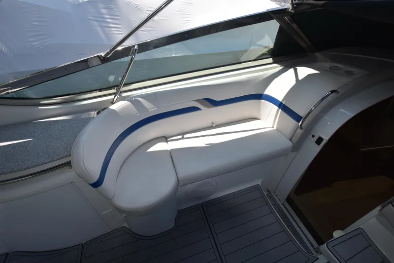 Slide: The Image of 2004 Formula 400 Super Sport boat interior with white and blue seating. - 9