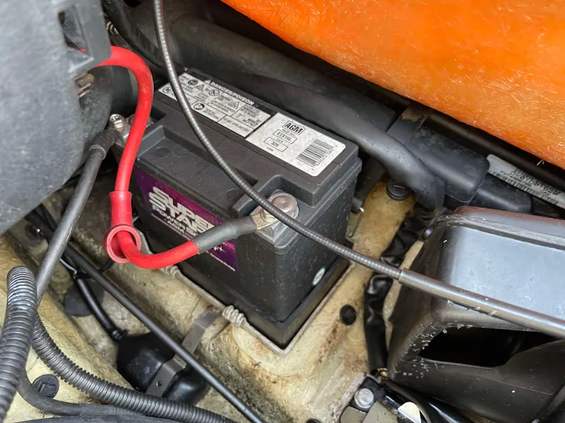 Slide: The Image of Battery compartment of a 2002 Sea-Doo RX watercraft with visible wiring. - 10