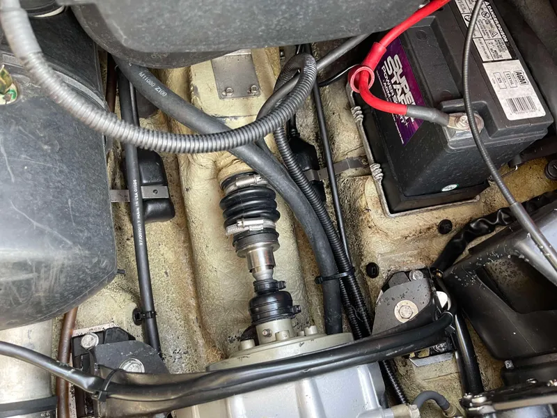 Slide: The Image of 2002 Sea-Doo RX engine compartment with visible battery and wiring. - 8