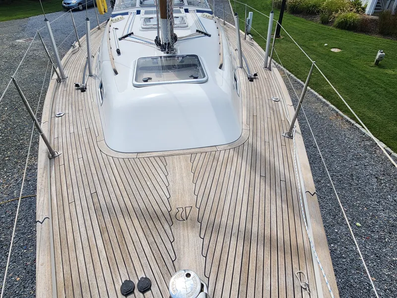 Slide: The Image of Deck view of 2016 Hallberg-Rassy 342 sailboat with teak finish and sleek design. - 10