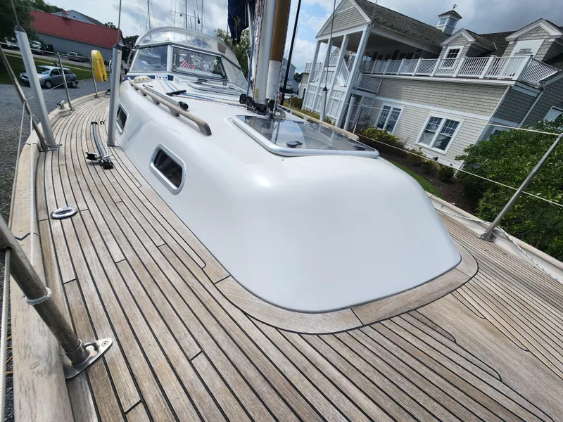 Slide: The Image of Hallberg-Rassy 342 sailboat deck, 2016 model, with wooden finish and sleek design. - 11
