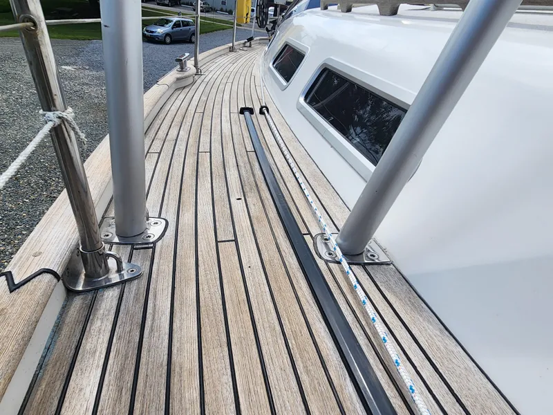 Slide: The Image of Teak deck of 2016 Hallberg-Rassy 342 sailboat, showcasing sleek design and craftsmanship. - 15