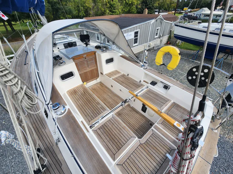 Slide: The Image of 2016 Hallberg-Rassy 342 sailboat cockpit with wooden deck and safety equipment. - 21