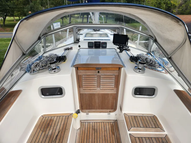 Slide: The Image of Hallberg-Rassy 342 sailboat cockpit, 2016 model, featuring teak flooring and navigation equipment. - 22