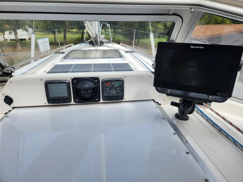 Slide: The Image of 2016 Hallberg-Rassy 342 yacht cockpit with navigation instruments and Raymarine display. - 23