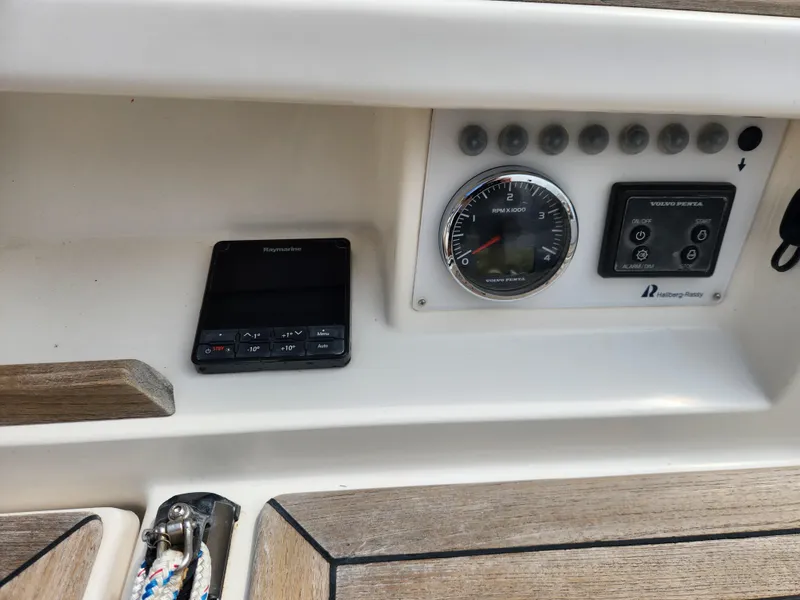 Slide: The Image of Control panel of a 2016 Hallberg-Rassy 342 sailboat with navigation instruments. - 24