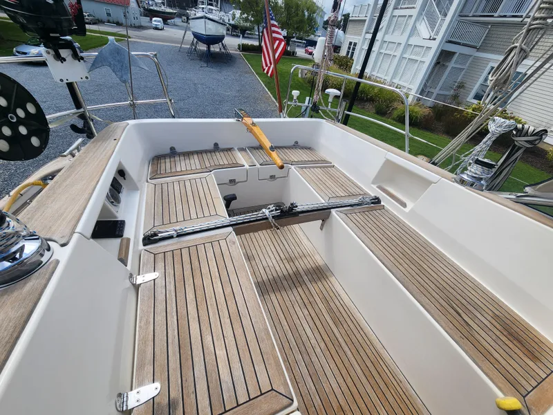 Slide: The Image of Hallberg-Rassy 342 sailboat cockpit with teak flooring, 2016 model, docked near residential area. - 25