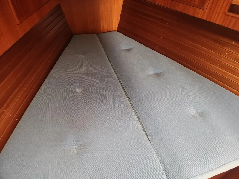 Slide: The Image of Interior cabin of 2016 Hallberg-Rassy 342 yacht with blue cushions. - 27
