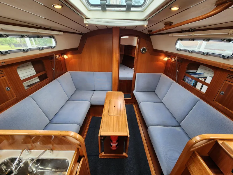 Slide: The Image of Interior of 2016 Hallberg-Rassy 342 yacht with cozy seating and wooden finishes. - 31