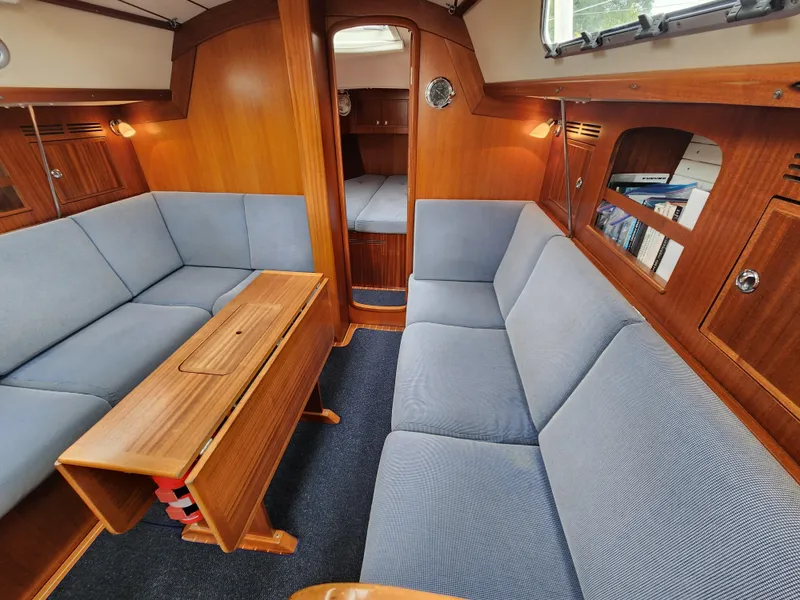 Slide: The Image of Interior of 2016 Hallberg-Rassy 342 yacht with wooden finish and blue upholstery. - 33