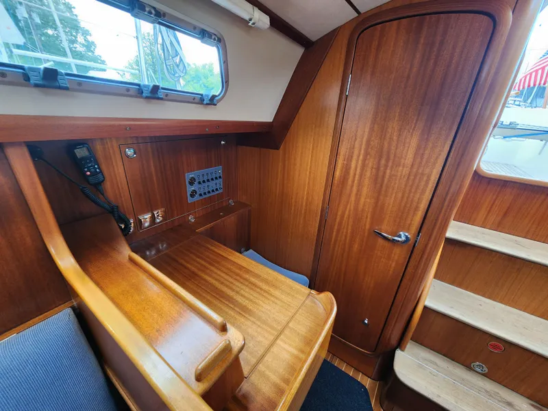 Slide: The Image of 2016 Hallberg-Rassy 342 interior with wooden finish and navigation station. - 36