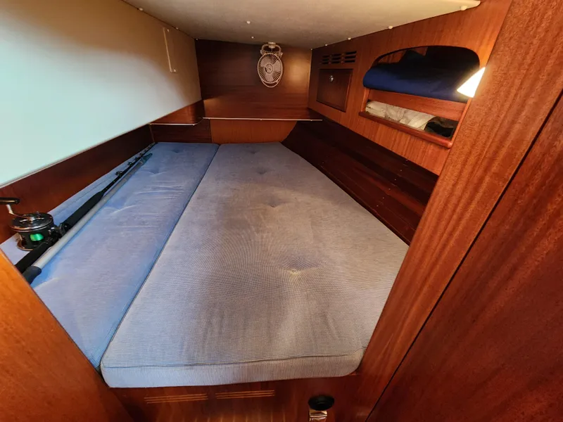 Slide: The Image of Cozy cabin interior of 2016 Hallberg-Rassy 342 sailboat with wooden finish and blue mattress. - 39