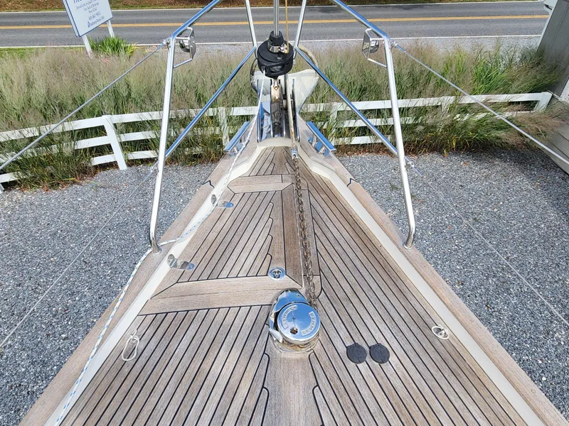 Slide: The Image of Bow of 2016 Hallberg-Rassy 342 sailboat with teak decking and anchor chain. - 9