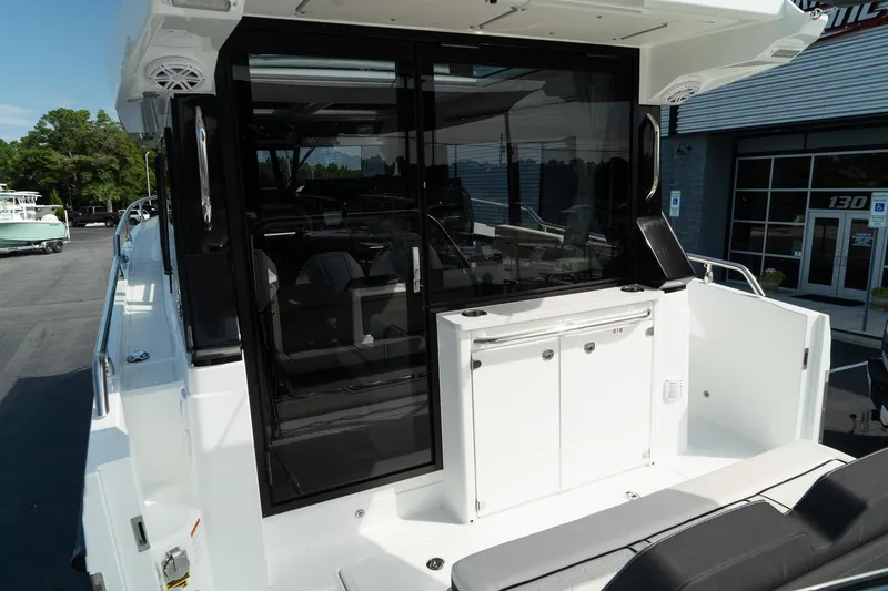 Slide: The Image of 2025 Wellcraft 355 boat with sleek design and modern amenities. - 12