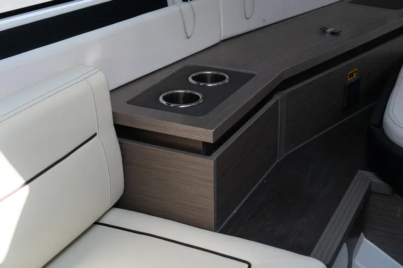 Slide: The Image of Interior of 2025 Wellcraft 355 boat with cup holders and seating. - 24