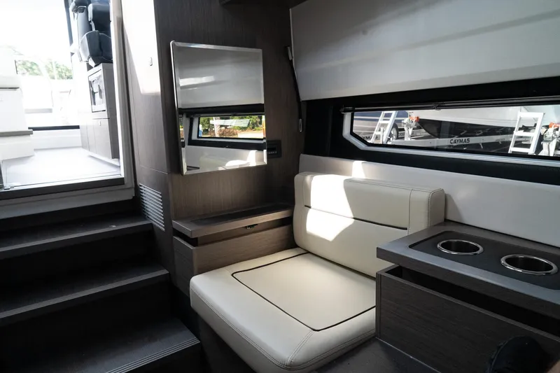 Slide: The Image of Interior of 2025 Wellcraft 355 boat, featuring modern seating and sleek design elements. - 25
