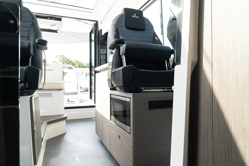 Slide: The Image of 2025 Wellcraft 355 interior with modern seating and sleek design. - 31
