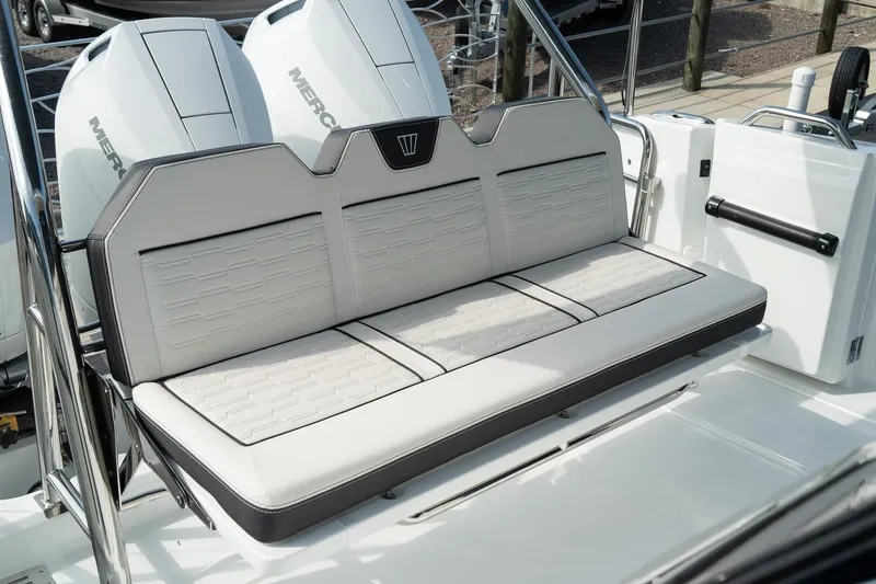 Slide: The Image of 2025 Wellcraft 355 boat seating with dual Mercury engines in the background. - 8