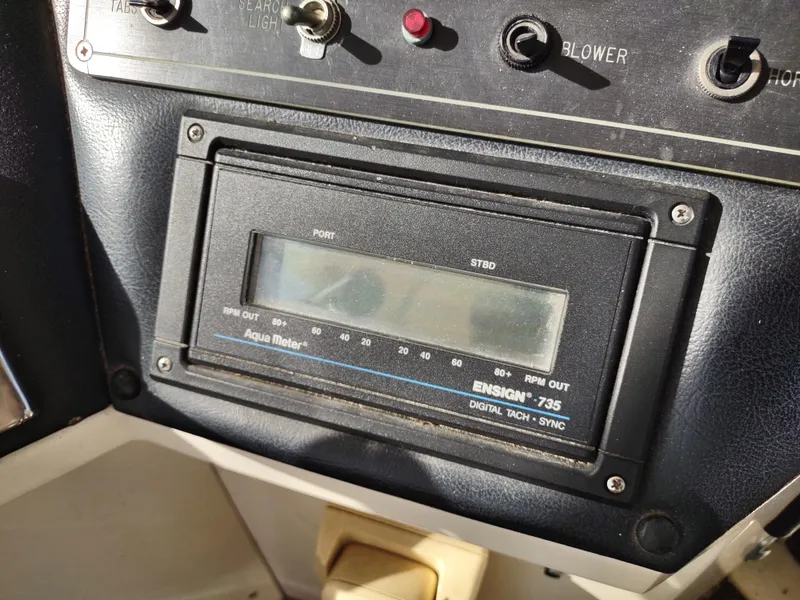 Slide: The Image of Control panel of a 1988 Marinette Marquis Motor Yacht with Aqua Meter Ensign 735 display. - 10