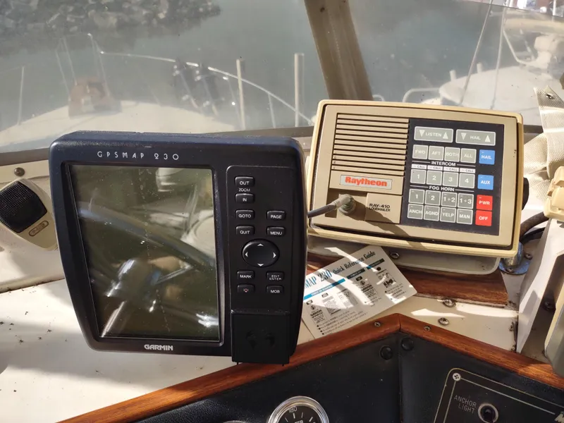 Slide: The Image of 1988 Marinette Marquis Motor Yacht dashboard with Garmin GPSMAP 230 and Raytheon marine equipment. - 11