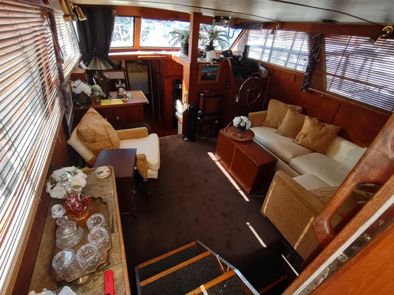Slide: The Image of Interior of 1988 Marinette Marquis Motor Yacht with cozy seating and elegant decor. - 16