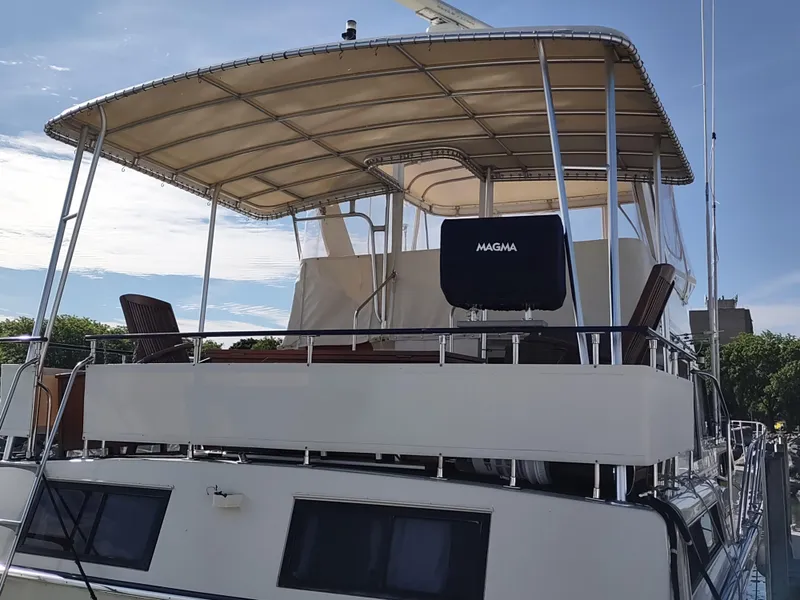 Slide: The Image of 1988 Marinette Marquis Motor Yacht with canopy and outdoor seating on deck. - 2