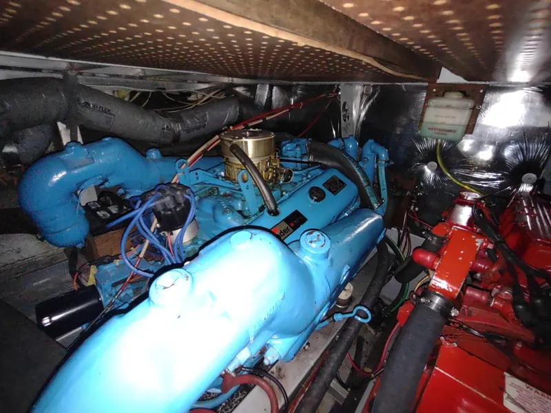 Slide: The Image of Engine room of 1988 Marinette Marquis Motor Yacht with blue and red components. - 32