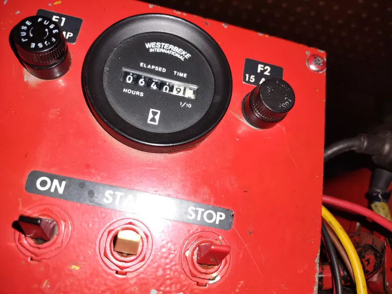 Slide: The Image of Red control panel with hour meter reading 6409 hours on a 1988 Marinette Marquis Motor Yacht. - 35