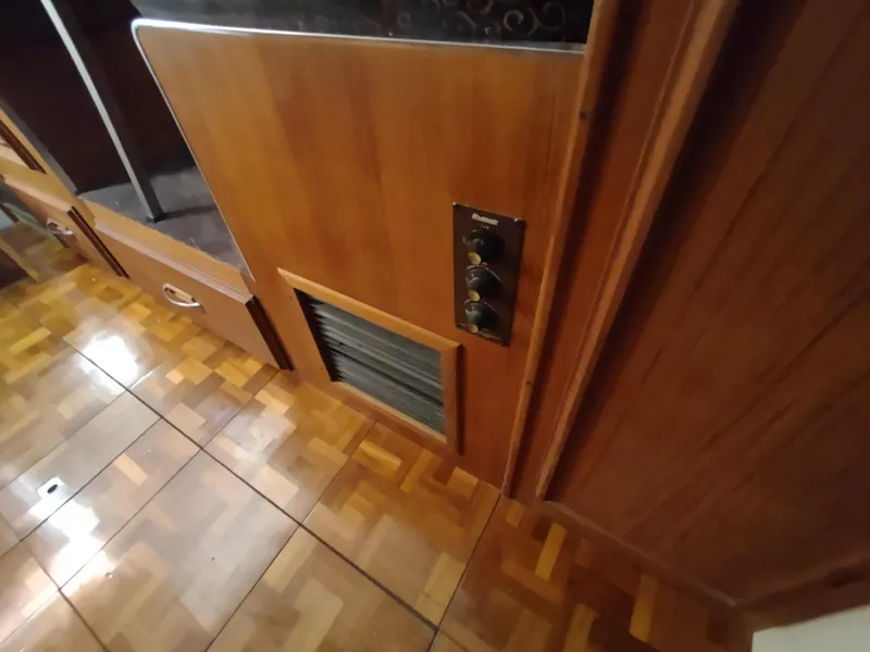 Slide: The Image of 1988 Marinette Marquis Motor Yacht interior with wood paneling and parquet flooring. - 39