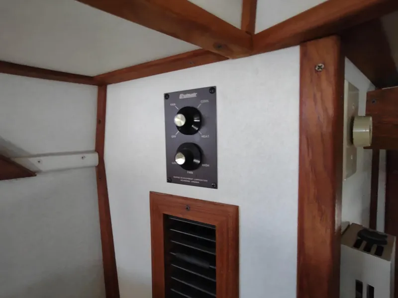 Slide: The Image of Control panel inside 1988 Marinette Marquis Motor Yacht with wooden trim. - 40