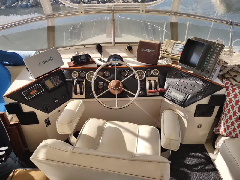 Slide: The Image of 1988 Marinette Marquis Motor Yacht helm with navigation equipment and steering wheel. - 8