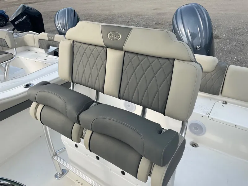 Slide: The Image of 2025 Key West 219 FS boat seating with quilted upholstery and dual outboard motors. - 3