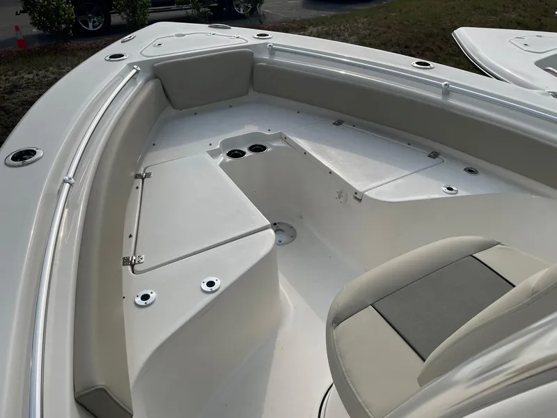 Slide: The Image of 2025 Key West 219 FS boat interior with seating and storage compartments. - 4
