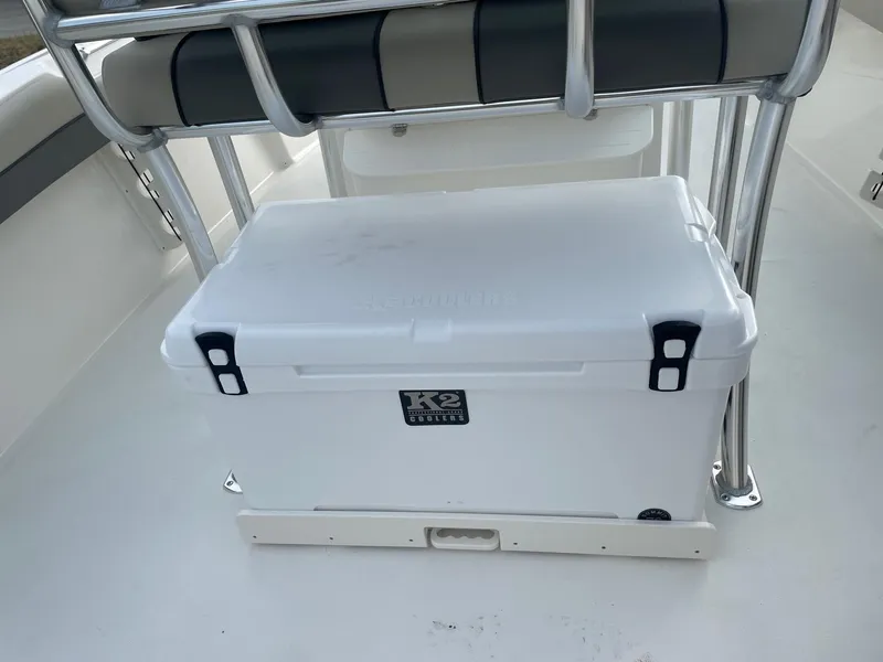 Slide: The Image of White cooler on 2025 Key West 219 FS boat deck, under metal frame seat. - 7
