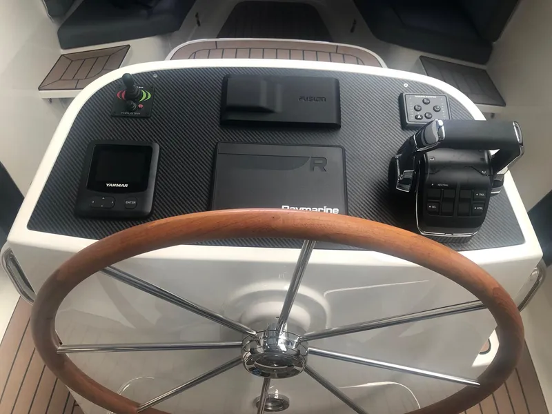 Slide: The Image of Steering wheel and controls of 2022 AdmiralsTender C28 boat cockpit. - 6