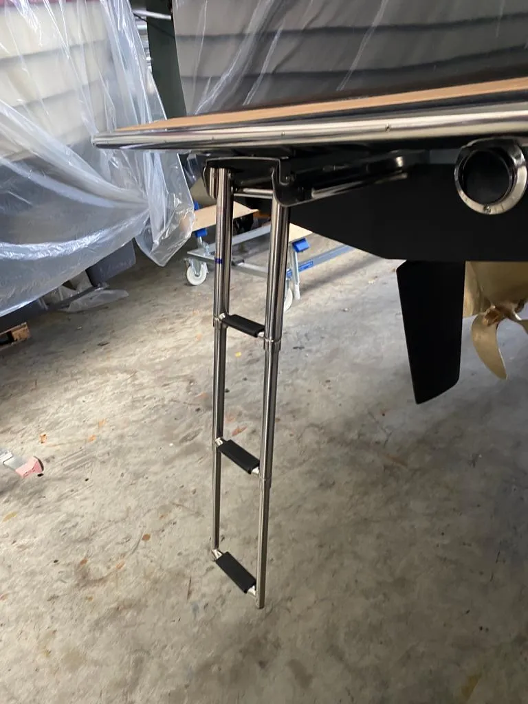 Slide: The Image of Stainless steel ladder on 2022 AdmiralsTender C28 boat in a workshop setting. - 8
