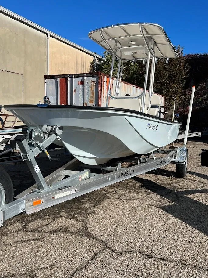 Slide: The Image of 2022 Boston Whaler 17 Montauk boat on trailer, parked outdoors. - 4