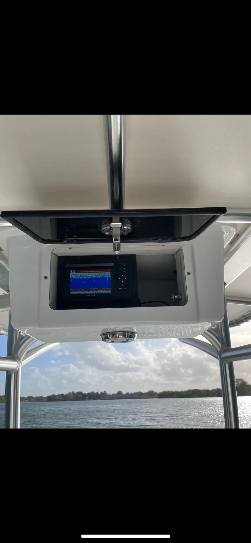 Slide: The Image of 2022 Boston Whaler 17 Montauk boat console with electronic display on a sunny day. - 6