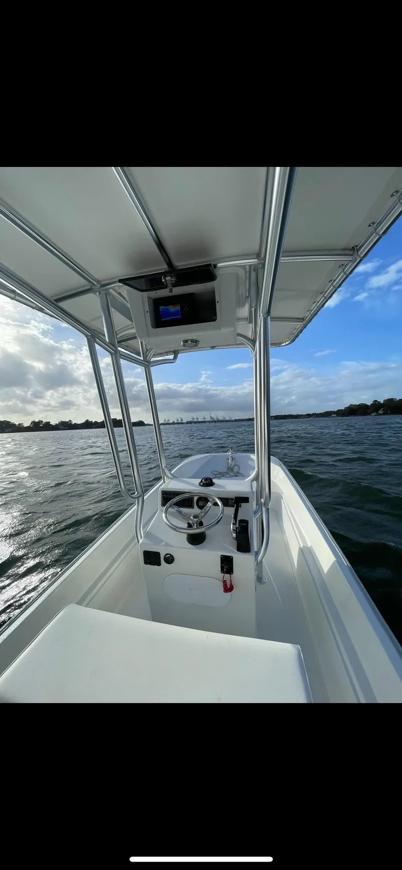 Slide: The Image of 2022 Boston Whaler 17 Montauk boat on open water, clear sky. - 7