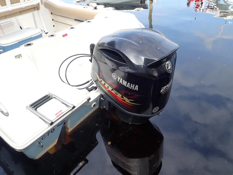 Slide: The Image of 2016 Tidewater 230 CC Adventure with Yamaha outboard motor on calm water. - 3